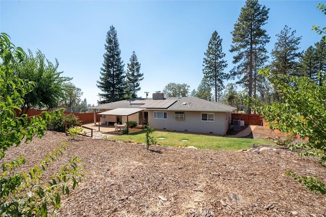 6354 Berkshire Ave, Paradise, CA 95969 - back of property with a fenced backyard, a patio, solar panels, and a chimney