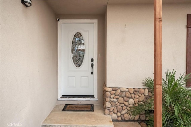 6354 Berkshire Ave, Paradise, CA 95969 - view of exterior entry featuring stucco siding and a surveillance system