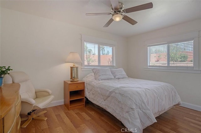 6354 Berkshire Ave, Paradise, CA 95969 - bedroom featuring multiple windows, wood finished floors, and ceiling fan