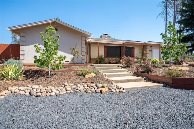 6354 Berkshire Ave, Paradise, CA 95969 - view of front of home featuring an attached garage, stucco siding, and a chimney