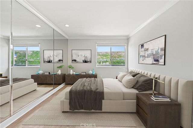 390 S Sepulveda Blvd Unit 105, Los Angeles, CA 90049 - bedroom featuring ornamental molding, light wood finished floors, multiple windows, and recessed lighting
