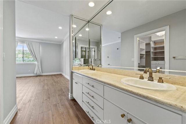 390 S Sepulveda Blvd Unit 105, Los Angeles, CA 90049 - full bath with double vanity, wood finished floors, and recessed lighting