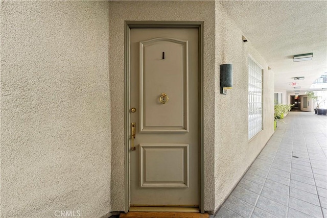 390 S Sepulveda Blvd Unit 105, Los Angeles, CA 90049 - view of exterior entry featuring stucco siding