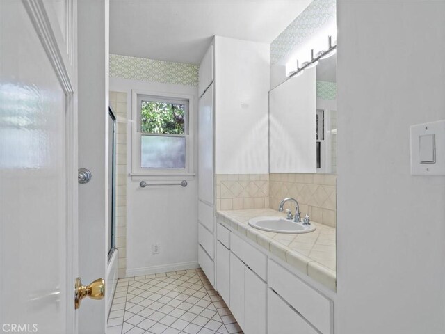 13510 Valleyheart Dr N, Sherman Oaks, CA 91423 - bathroom featuring vanity, tile patterned floors, and enclosed tub / shower combo