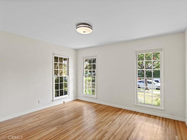 13510 Valleyheart Dr N, Sherman Oaks, CA 91423 - unfurnished room featuring baseboards and light wood-style floors