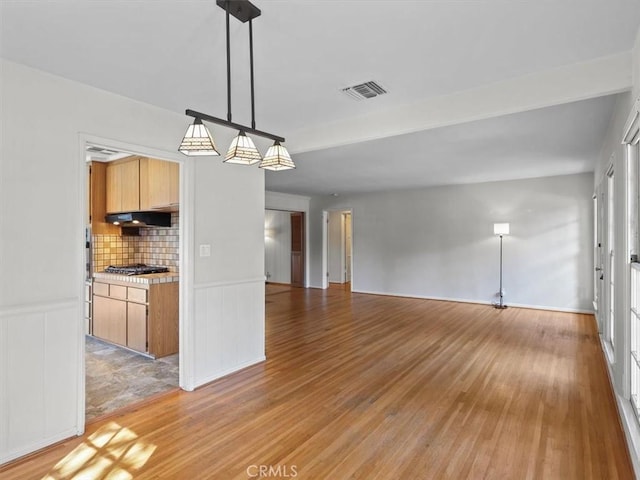 13510 Valleyheart Dr N, Sherman Oaks, CA 91423 - unfurnished room with light wood finished floors and wainscoting