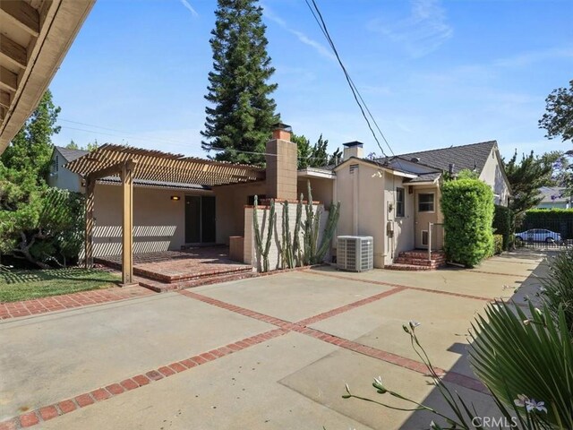 13510 Valleyheart Dr N, Sherman Oaks, CA 91423 - back of property featuring stucco siding, a chimney, a patio, and a pergola