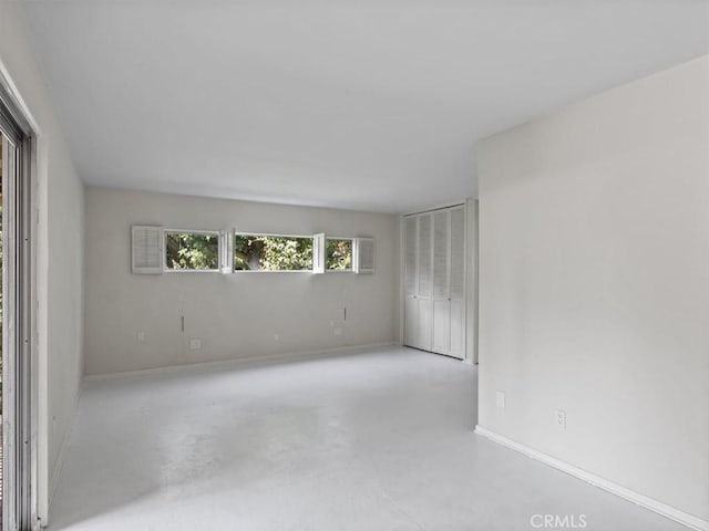 13510 Valleyheart Dr N, Sherman Oaks, CA 91423 - spare room featuring concrete flooring and baseboards