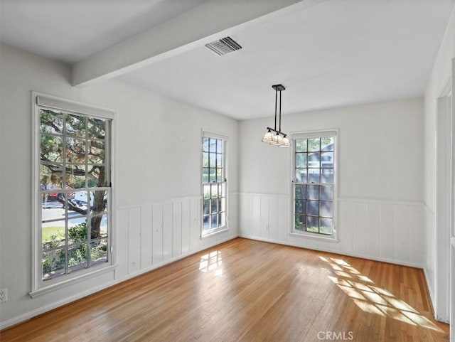13510 Valleyheart Dr N, Sherman Oaks, CA 91423 - spare room featuring wood finished floors, wainscoting, a chandelier, and beam ceiling