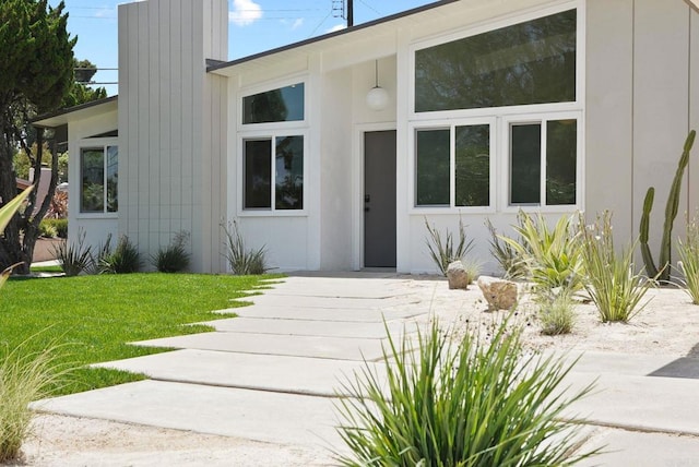 8602 Kilbourn Dr, La Jolla, CA 92037 - doorway to property featuring a lawn and a chimney