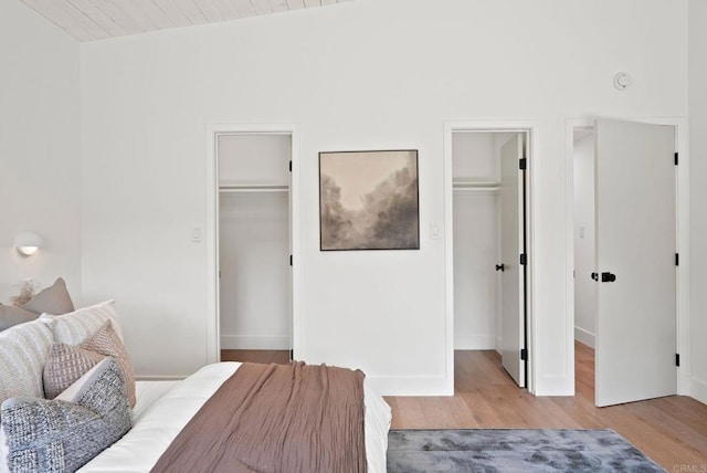 8602 Kilbourn Dr, La Jolla, CA 92037 - bedroom featuring a spacious closet and wood finished floors