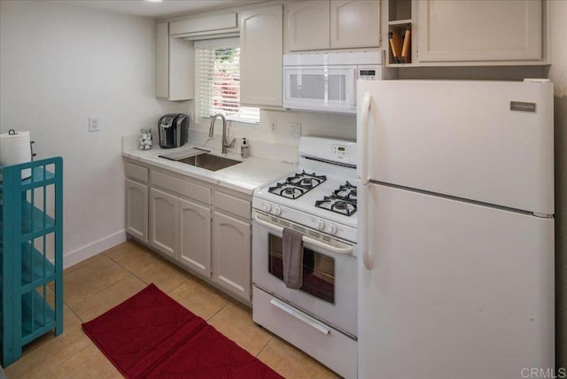 260406 Juan St, San Diego, CA 92110 - kitchen with white appliances, light countertops, and light tile patterned floors
