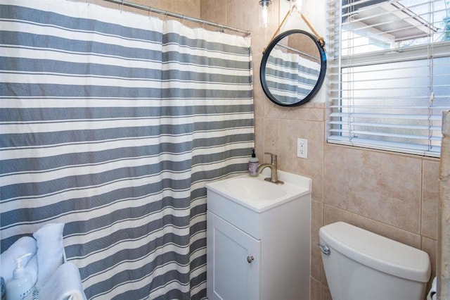 260406 Juan St, San Diego, CA 92110 - full bathroom with tile walls, vanity, and a shower with curtain