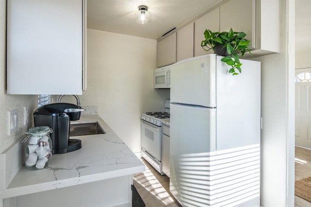260406 Juan St, San Diego, CA 92110 - kitchen featuring white appliances and light stone countertops
