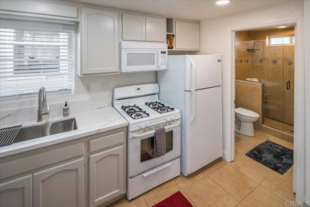 260406 Juan St, San Diego, CA 92110 - kitchen featuring white appliances, light tile patterned flooring, light countertops, and recessed lighting