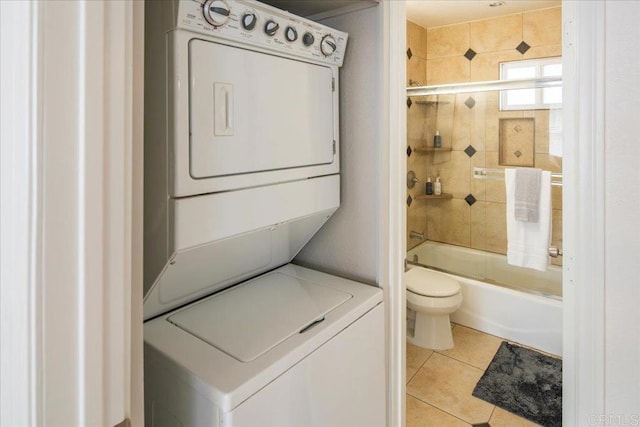260406 Juan St, San Diego, CA 92110 - bathroom featuring stacked washer / drying machine, bath / shower combo with glass door, and tile patterned floors