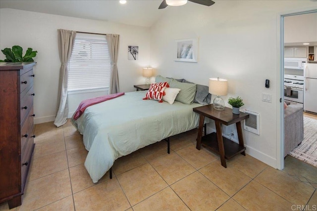 260406 Juan St, San Diego, CA 92110 - bedroom featuring lofted ceiling, freestanding refrigerator, light tile patterned floors, ceiling fan, and recessed lighting