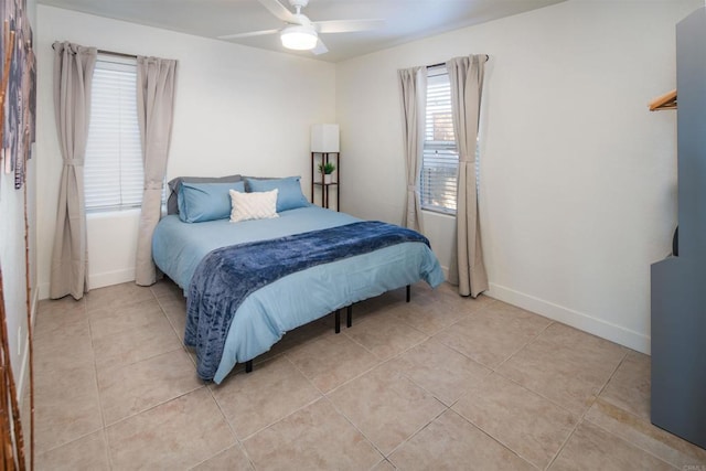 260406 Juan St, San Diego, CA 92110 - bedroom with light tile patterned flooring and a ceiling fan