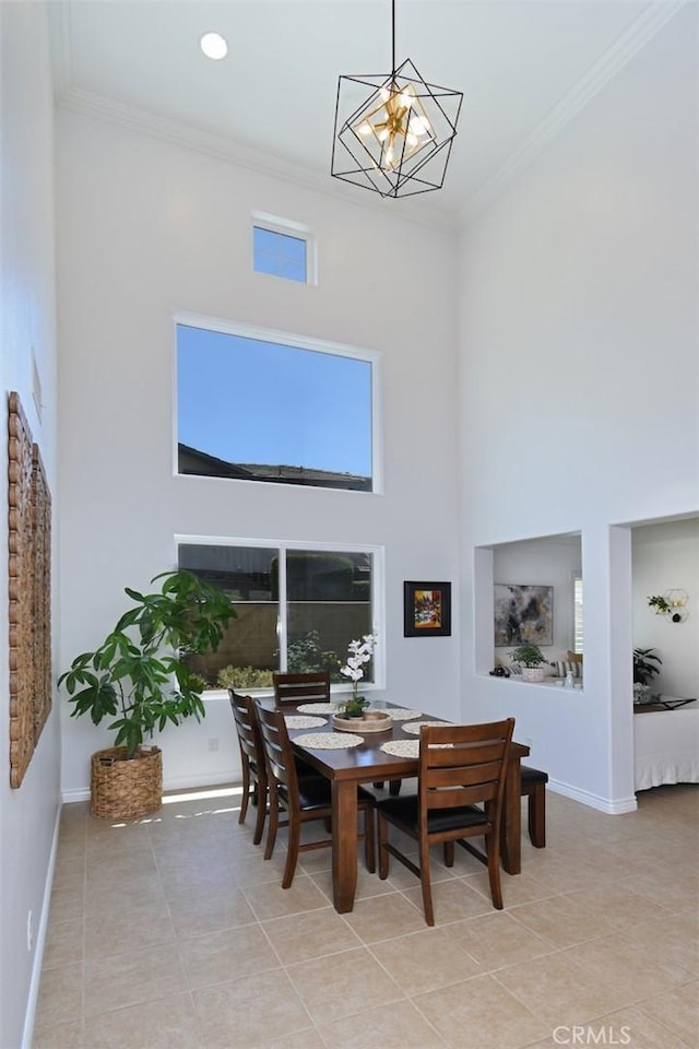 49 Mountain Laurel Way, Azusa, CA 91702 - dining space with a high ceiling, ornamental molding, light tile patterned floors, and a chandelier