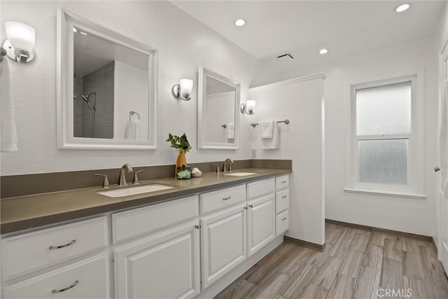 25 Misty Way, Chico, CA 95926 - bathroom with double vanity, wood finished floors, recessed lighting, and a shower