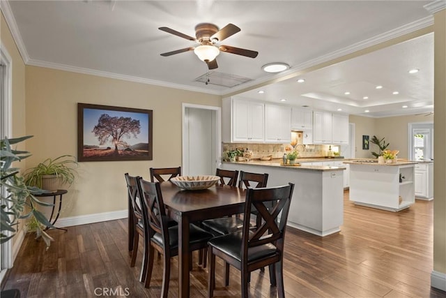 25 Misty Way, Chico, CA 95926 - dining area featuring hardwood / wood-style floors, ornamental molding, a ceiling fan, a tray ceiling, and recessed lighting