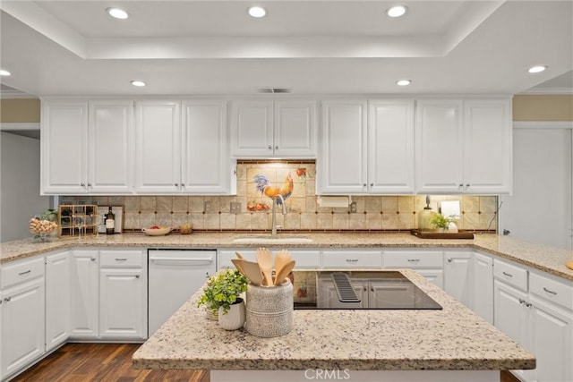 25 Misty Way, Chico, CA 95926 - kitchen featuring white dishwasher, a tray ceiling, dark wood-style floors, black electric stovetop, and white cabinetry