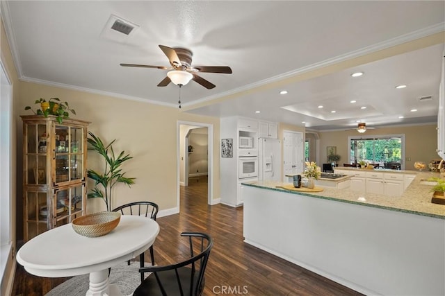 25 Misty Way, Chico, CA 95926 - dining area featuring a ceiling fan, dark wood-type flooring, recessed lighting, crown molding, and a tray ceiling