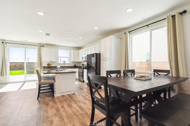 13343 Macaw Pl, Victorville, CA 92395 - dining area featuring light wood-style flooring and recessed lighting