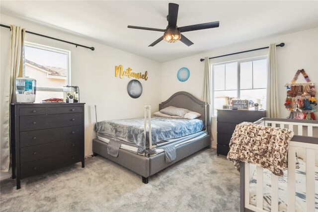 13343 Macaw Pl, Victorville, CA 92395 - bedroom with multiple windows, carpet, and ceiling fan