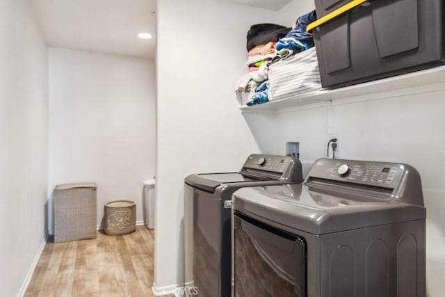 13343 Macaw Pl, Victorville, CA 92395 - laundry room with washing machine and clothes dryer and light wood-style floors
