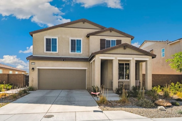 13343 Macaw Pl, Victorville, CA 92395 - view of front of house with driveway, an attached garage, covered porch, and stucco siding