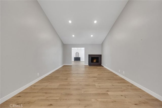 1106 W Bellbrook St, Covina, CA 91722 - unfurnished living room with a fireplace, light wood-type flooring, and recessed lighting