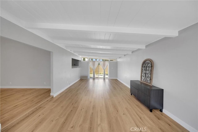 1106 W Bellbrook St, Covina, CA 91722 - unfurnished living room with light wood-style flooring and beamed ceiling