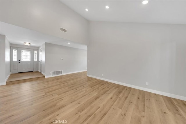 1106 W Bellbrook St, Covina, CA 91722 - unfurnished living room with light wood-style floors and recessed lighting