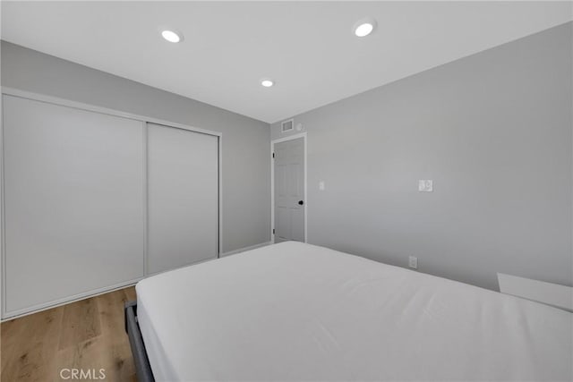 1106 W Bellbrook St, Covina, CA 91722 - bedroom featuring light wood finished floors, recessed lighting, and a closet
