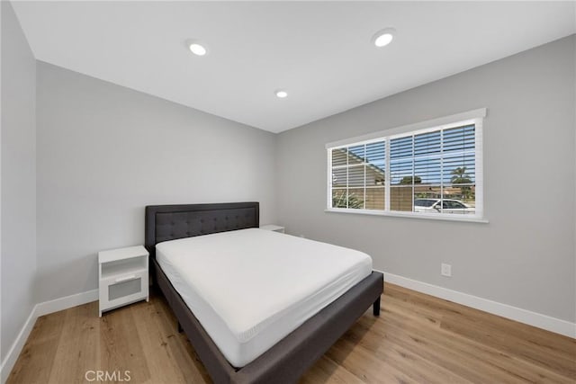 1106 W Bellbrook St, Covina, CA 91722 - bedroom with light wood-style floors and recessed lighting