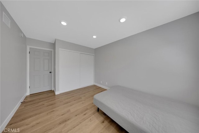 1106 W Bellbrook St, Covina, CA 91722 - unfurnished bedroom featuring light wood-style flooring, recessed lighting, and a closet