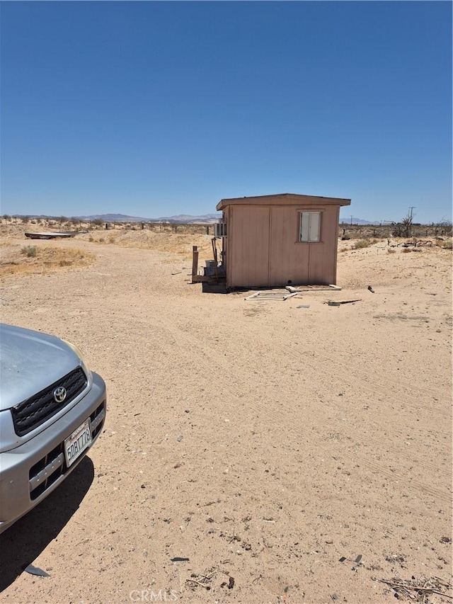 45146 Fairview Rd, Newberry Springs, CA 92365 - view of yard with a shed, view of desert, and a view of rural / pastoral area