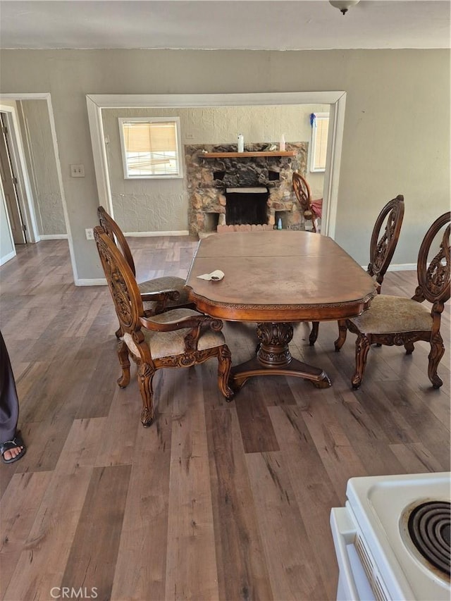 45146 Fairview Rd, Newberry Springs, CA 92365 - dining space with wood finished floors and a fireplace