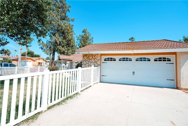 3473 Yankee Cir, Riverside, CA 92503 - view of front of house with a tiled roof, stucco siding, and driveway