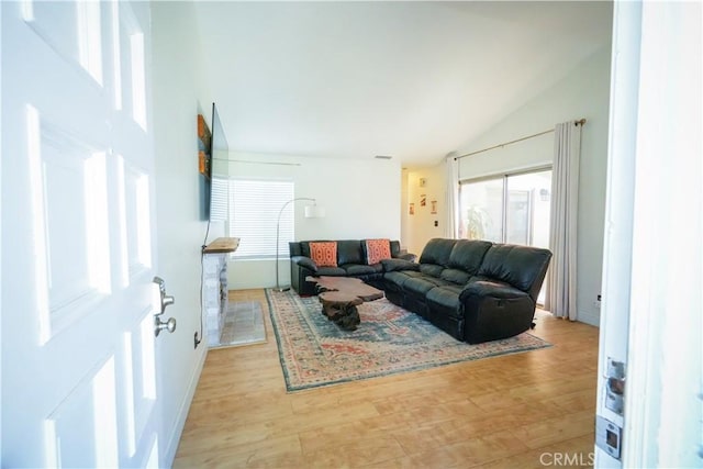 3473 Yankee Cir, Riverside, CA 92503 - living room with vaulted ceiling and light wood-style flooring