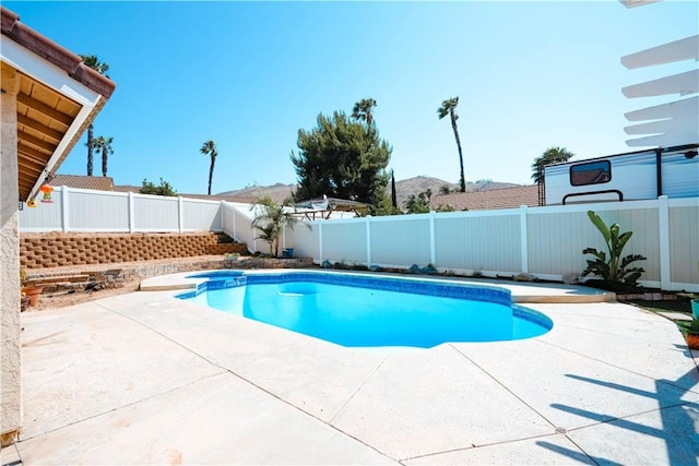3473 Yankee Cir, Riverside, CA 92503 - view of pool featuring a patio area, a fenced backyard, and a mountain view