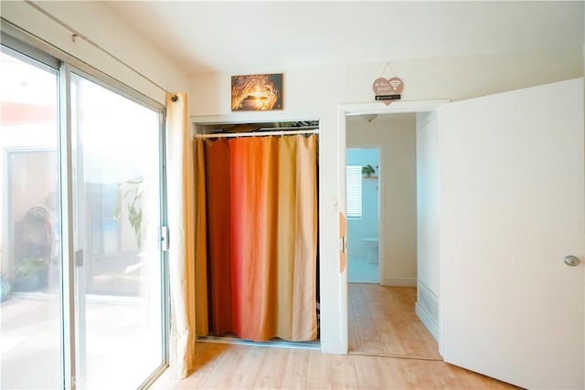 3473 Yankee Cir, Riverside, CA 92503 - unfurnished bedroom featuring multiple windows and light wood finished floors