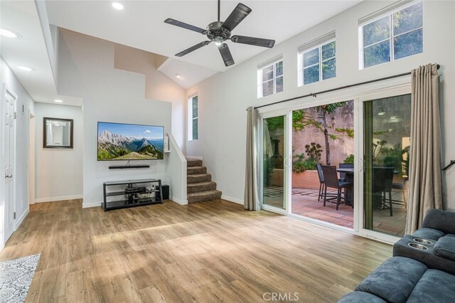 4347 Freedom Dr Unit C, Calabasas, CA 91302 - living area featuring wood finished floors, stairway, ceiling fan, high vaulted ceiling, and recessed lighting