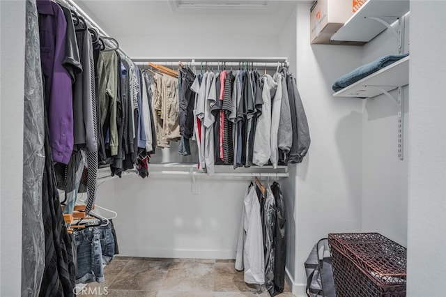 4347 Freedom Dr Unit C, Calabasas, CA 91302 - walk in closet with attic access and stone finish floors