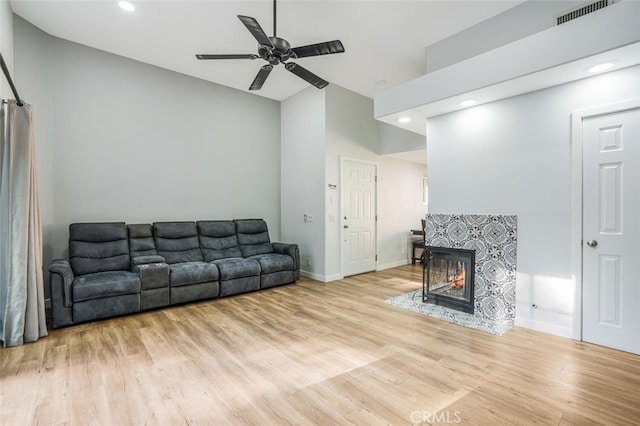 4347 Freedom Dr Unit C, Calabasas, CA 91302 - living area with wood finished floors, a tiled fireplace, a ceiling fan, vaulted ceiling, and recessed lighting