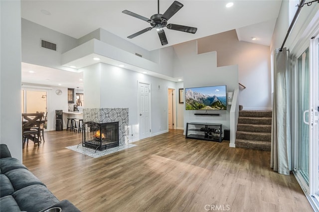4347 Freedom Dr Unit C, Calabasas, CA 91302 - living area with a high ceiling, wood finished floors, stairway, ceiling fan, and recessed lighting