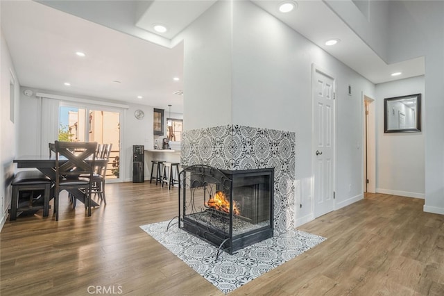4347 Freedom Dr Unit C, Calabasas, CA 91302 - living room featuring wood finished floors, recessed lighting, and a multi sided fireplace