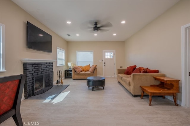 1409 4th St, San Fernando, CA 91340 - living room with ceiling fan, recessed lighting, and a brick fireplace