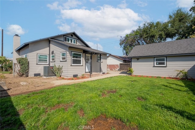 1409 4th St, San Fernando, CA 91340 - back of house featuring a lawn and a chimney